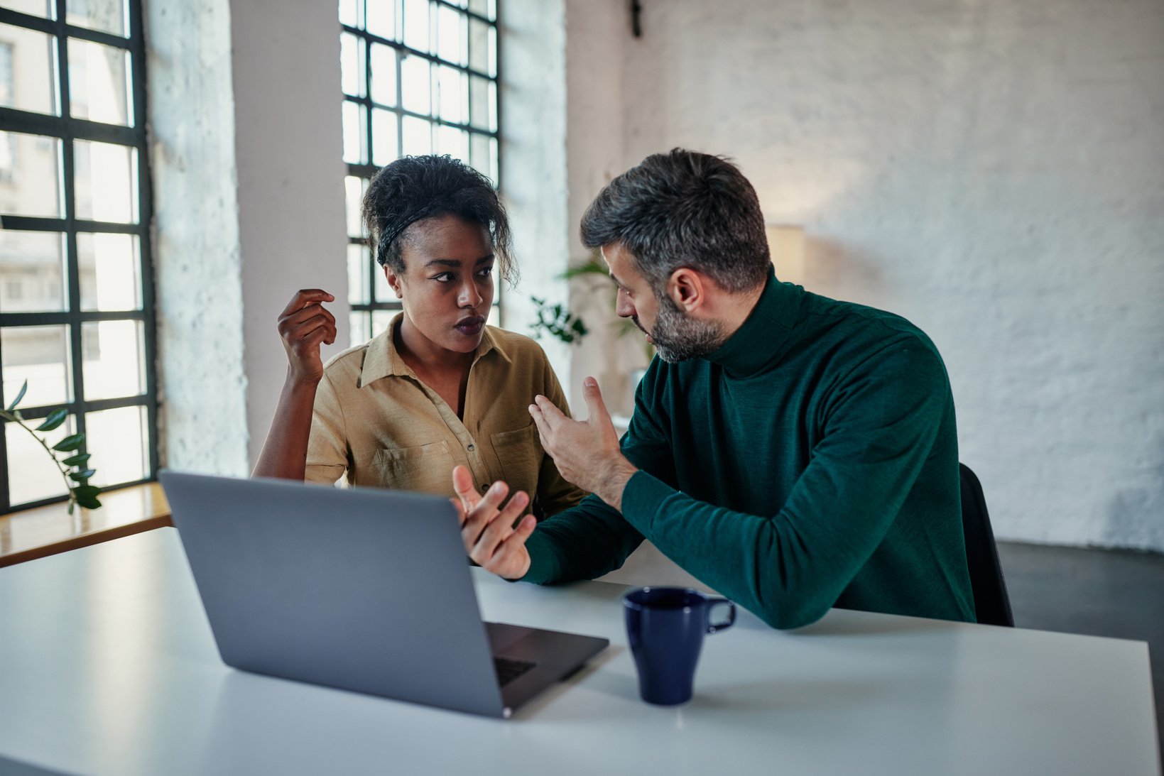 Couple arguing during therapy session with online psychologist